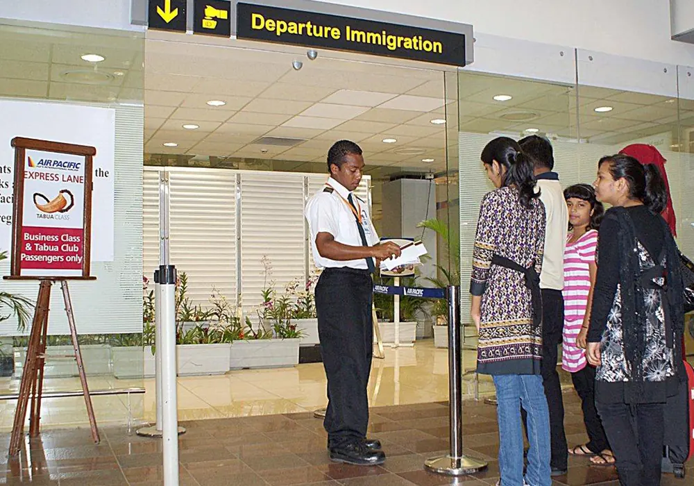 Guardforce officers at an airport departure hall