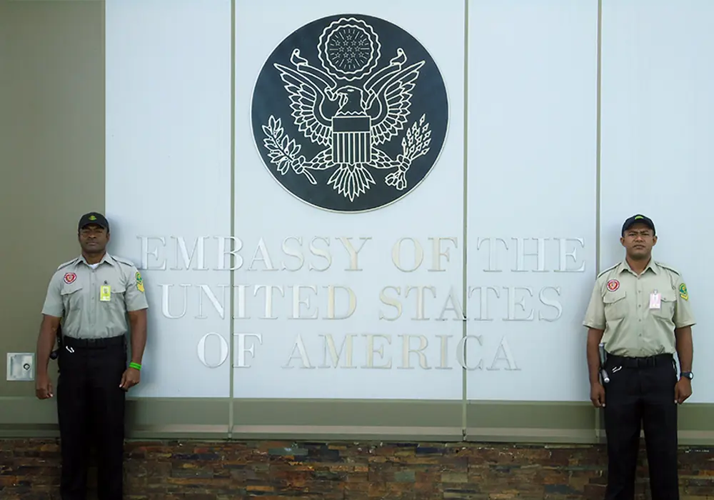Guardforce officer at an embassy entrance